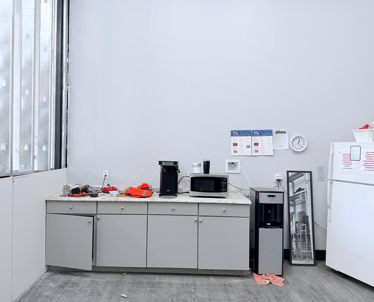 Commercial break room with base cabinets before wall cabinets were installed