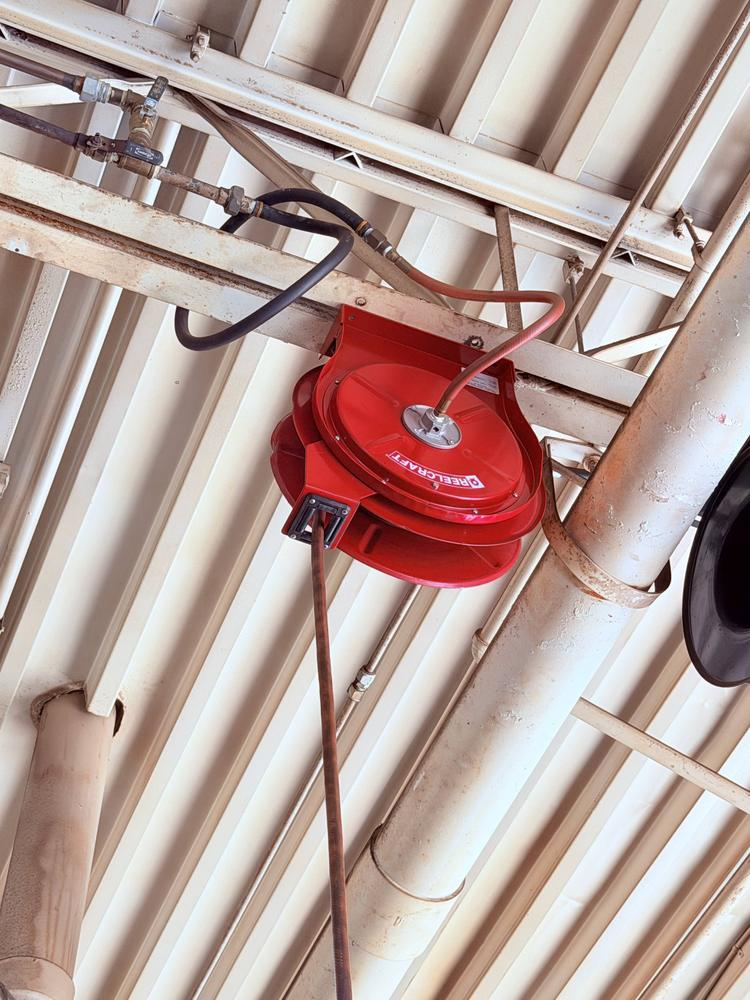 Replacement ceiling-mounted air hose reel installed in a commercial facility
