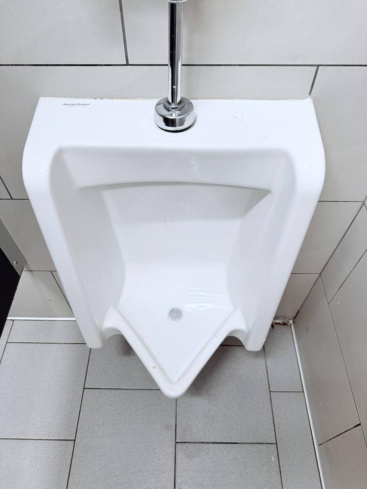 Commercial urinal cleared and returned to service after a blockage