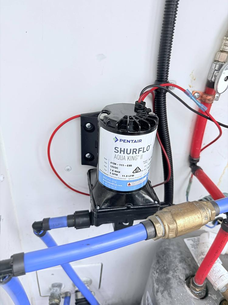 Water pump and supply plumbing installed in a commercial facility